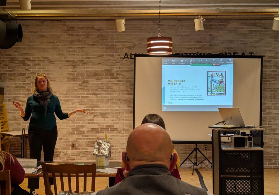 A presenter addressing the cohort