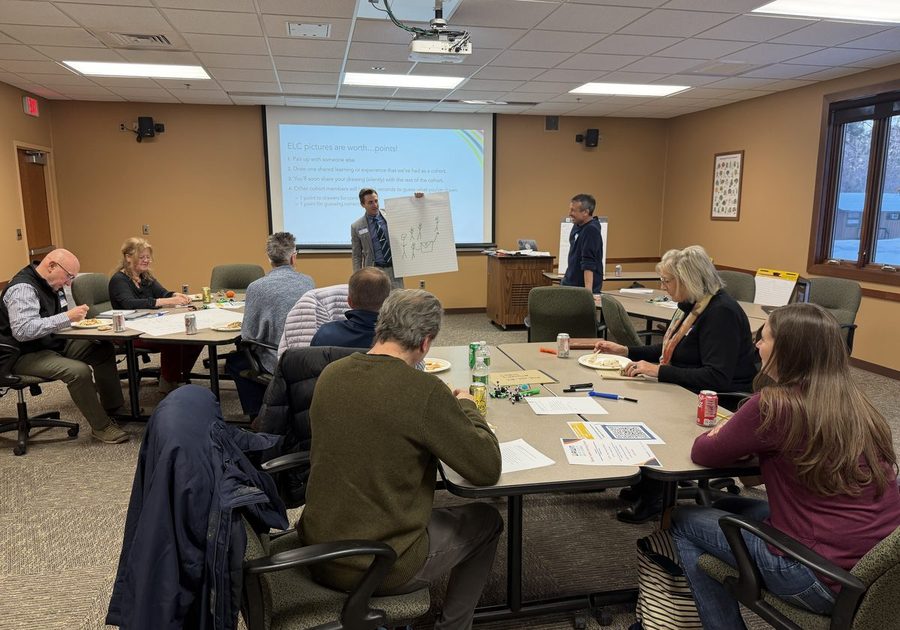 Cohort members in roundtable dialogue during an ELC session